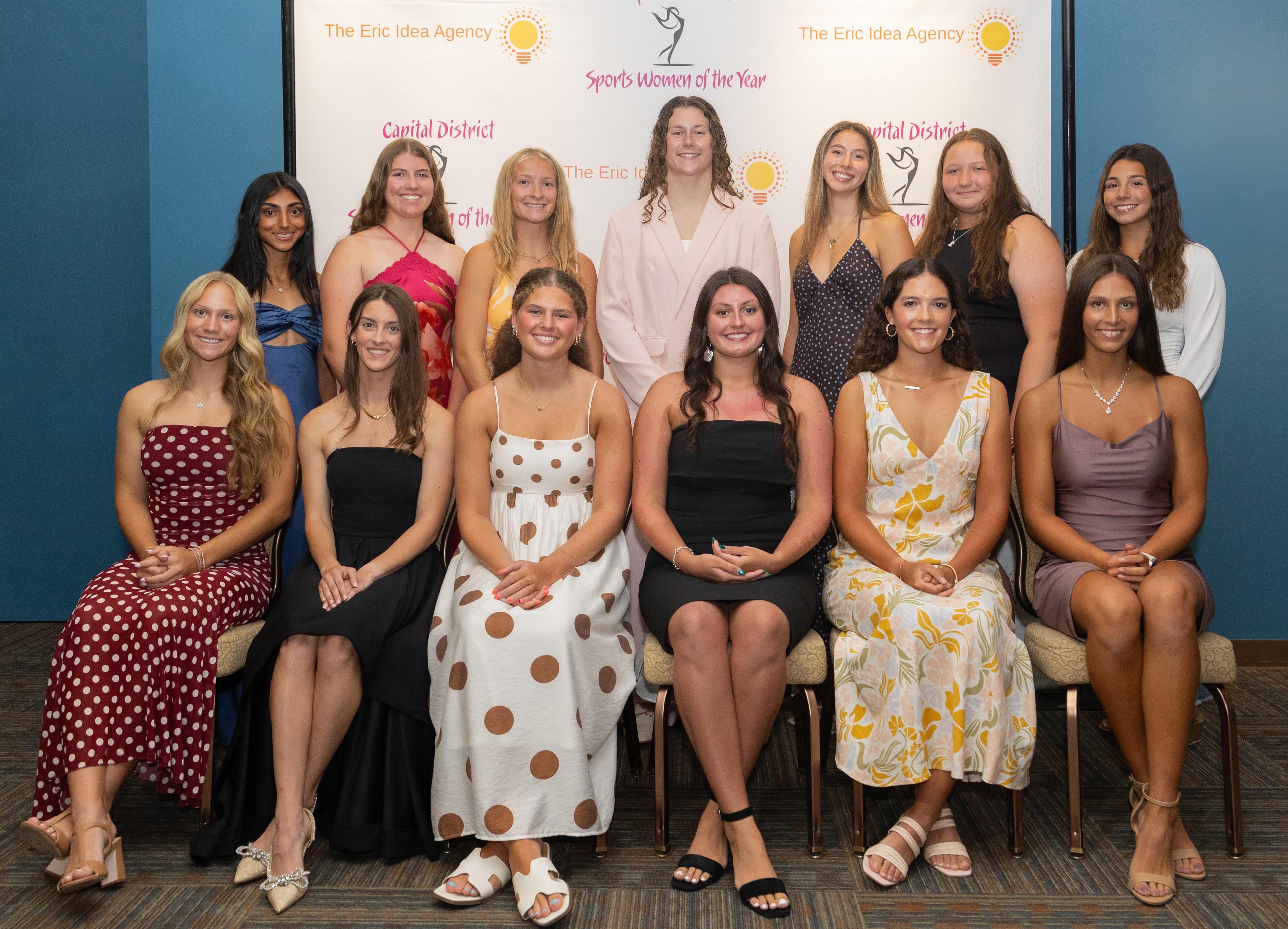 A group of women in front of a backdrop "Sports Women of the Year"